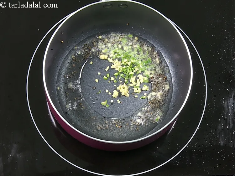 Step 12 – Add 1/2 tsp&nbsp;finely&nbsp;<a href="https://www.tarladalal.com/glossary-chopped-ginger-786i">chopped ginger (adrak)</a>.