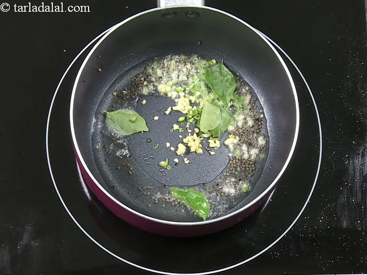 Step 13 – Add 5&nbsp;<a href="https://www.tarladalal.com/glossary-curry-leaves-kadi-patta-kadipatta-388i">curry leaves (kadi patta)</a>.