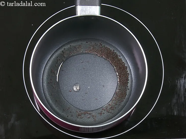 Step 10 – Add 1/2 tsp&nbsp;<a href="https://www.tarladalal.com/glossary-mustard-seeds-sarson-rai-sarson-ke-beej-525i">mustard seeds ( rai / sarson)</a>.