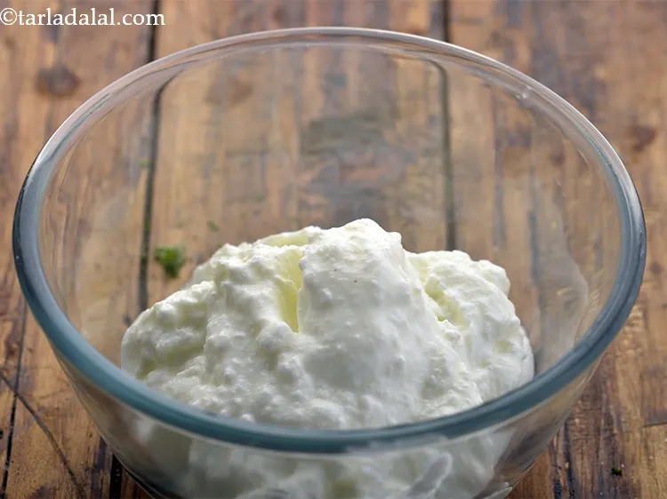 Step 23 – For preparing the falafel dressing, in a deep bowl, take 1 cup curd.