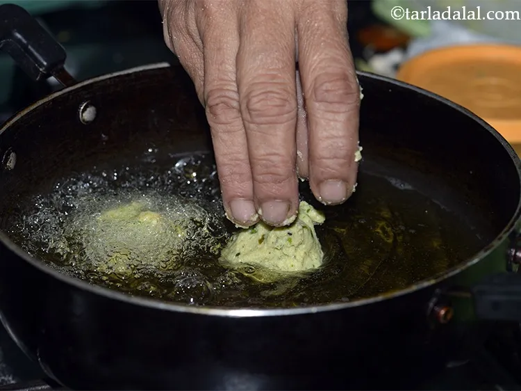 Step 18 – Shape a portion into a round ball and put in hot oil in a deep …