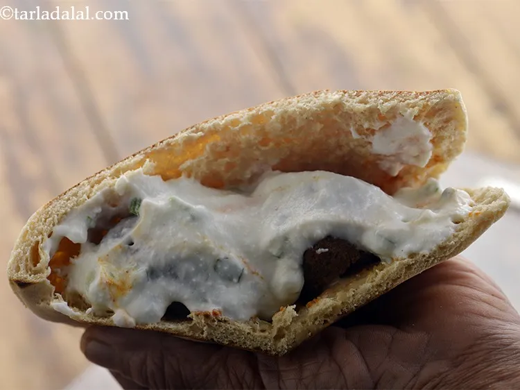 Step 36 – Top it with 1&frac12; tbsp of the prepared curd dressing.