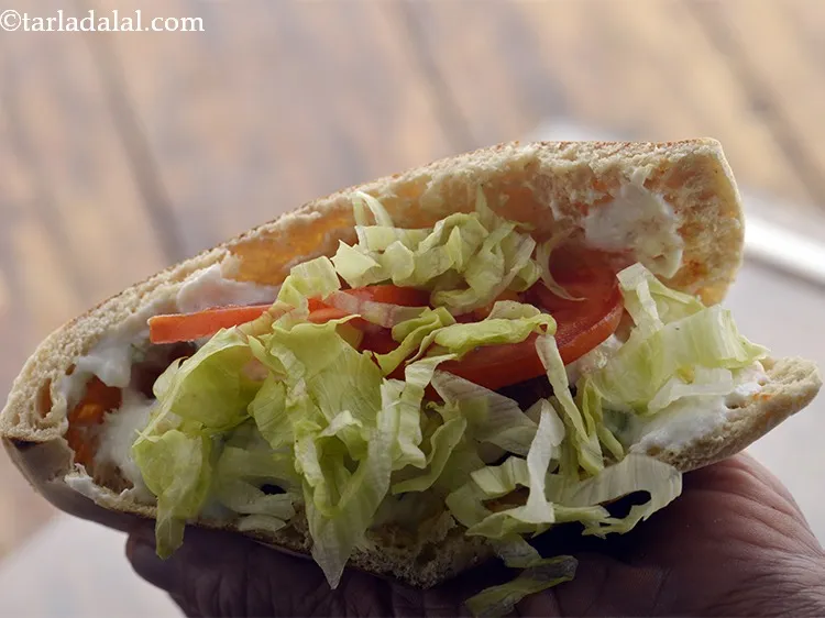 Step 38 – Spread 1 tbsp of the shredded lettuce.