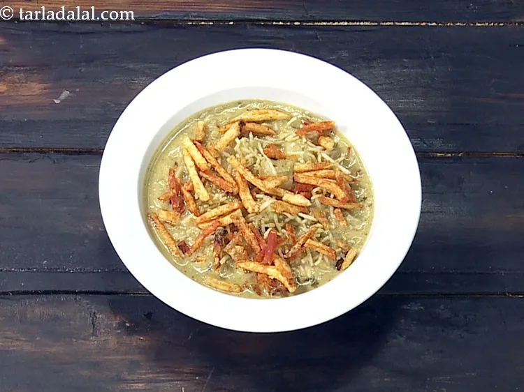 Step 40 – Next top with 2 tbsp of <a href="https://www.tarladalal.com/glossary-potato-salli-713i">masala salli</a> evenly over it.