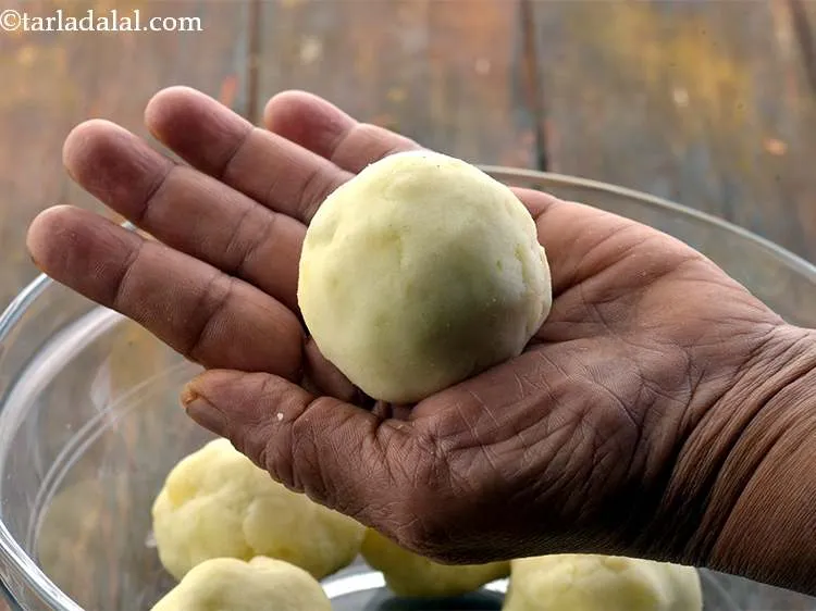 Step 25 – Shape it into a round ball. Keep aside on a plate. You can flatten it …