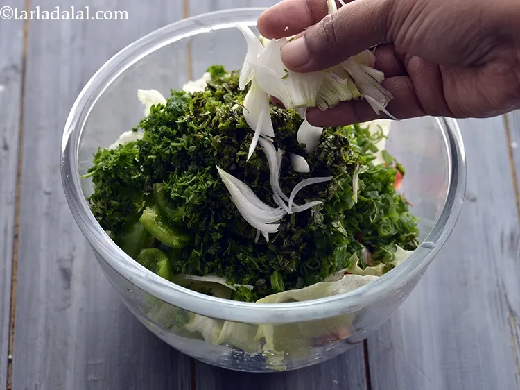 Step 23 – Add sliced spring onion whites.