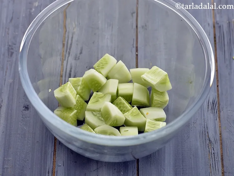 Step 16 – In a deep bowl take the cucumber cubes. They provide a refreshing crunch to the …