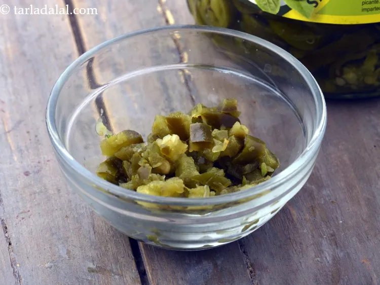 Step 20 – For a spicy topping, add some finely chopped jalapenos.&nbsp;