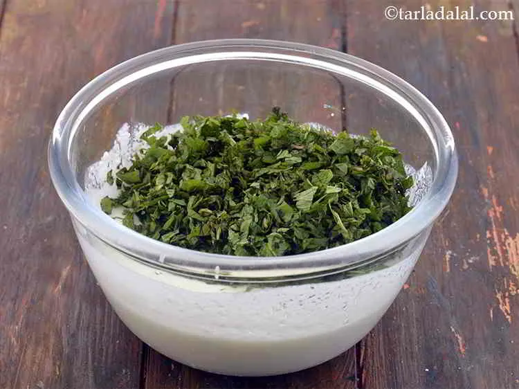 Step 9 – Add the mint leaves to add a hint of freshness to your <strong>Flax seed Raita.</strong>