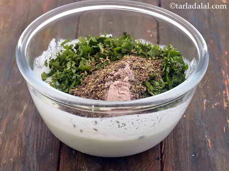 Step 12 – Add the black salt. It is added to flavor the curd.