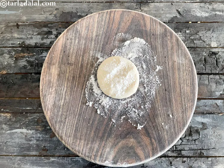 Step 21 – Flatten the dough and put a bit of plain flour over it.