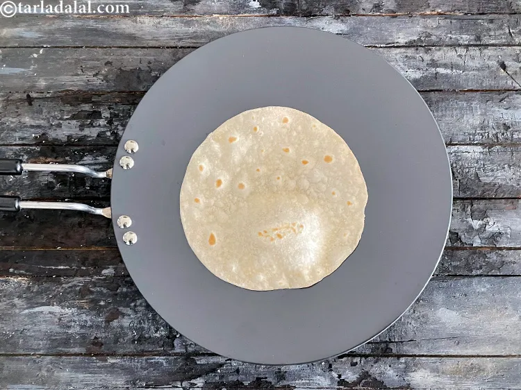 Step 24 – Cook each roti till light brown spots appear on both the sides. You will have …