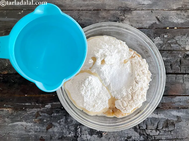 Step 15 – Add enough water to knead into a soft dough. We first added 1/2 cup water …