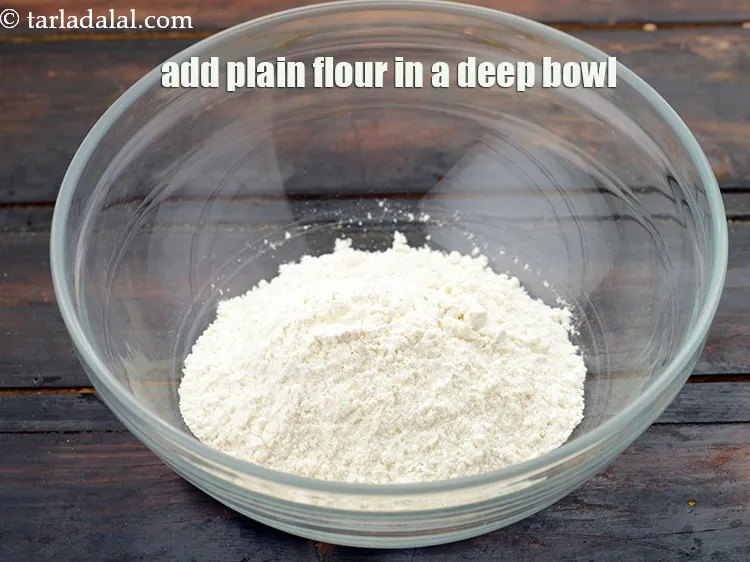 Step 12 – Take a deep bowl, add 1/2 cup&nbsp;<a href="https://www.tarladalal.com/glossary-plain-flour-maida-188i">plain flour (maida)</a>.