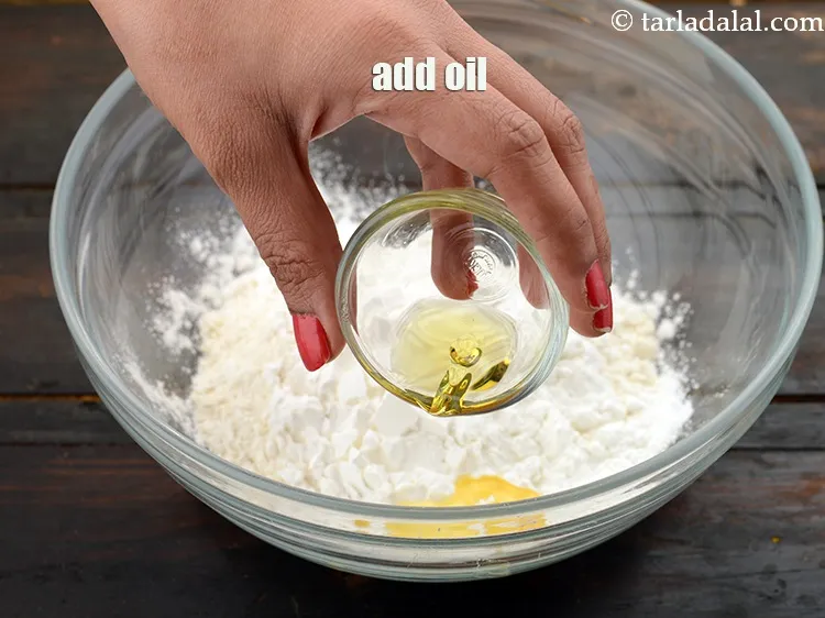 Step 14 – Add&nbsp;1 tsp&nbsp;<a href="https://www.tarladalal.com/glossary-oil-671i">oil</a>.