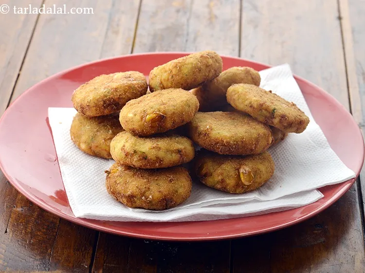 Step 22 – Add 2 to 3 fritters and deep-fry till they turn golden brown in colour from …