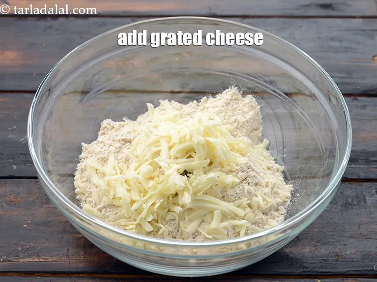 Step 14 – Add &frac14; cup&nbsp;<a href="https://www.tarladalal.com/glossary-grated-processed-cheese-868i">grated processed cheese</a>.