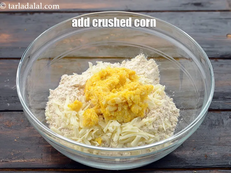 Step 15 – Add 1/4 cup&nbsp;<a href="https://www.tarladalal.com/glossary-boiled-and-crushed-sweet-corn-kernels-1930i">boiled and crushed sweet corn kernels</a>.