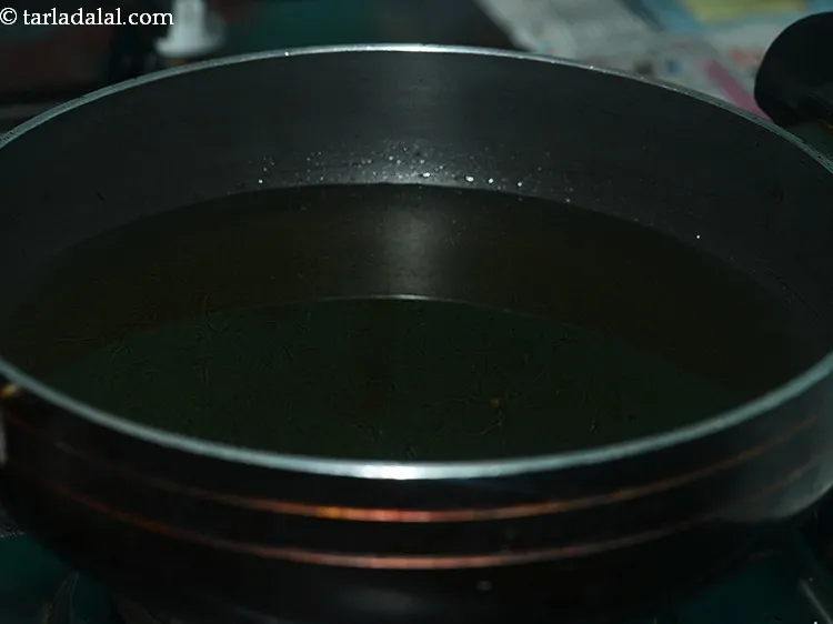 Step 4 – Heat the oil for deep-frying in a deep non-stick pan.