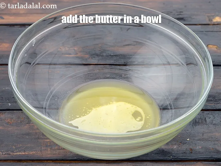 Step 3 – For the herb mixture, add 2 tbsp&nbsp;<a href="https://www.tarladalal.com/glossary-melted-butter-1941i">melted butter</a>&nbsp;in a bowl.