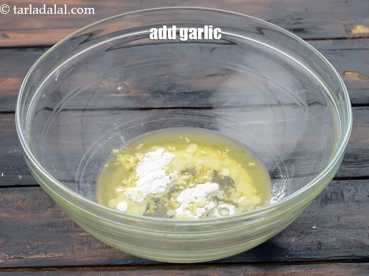 Step 6 – Add 1 tsp&nbsp;<a href="https://www.tarladalal.com/glossary-grated-garlic-859i">grated garlic (lehsun)</a>&nbsp;, optional.&nbsp;