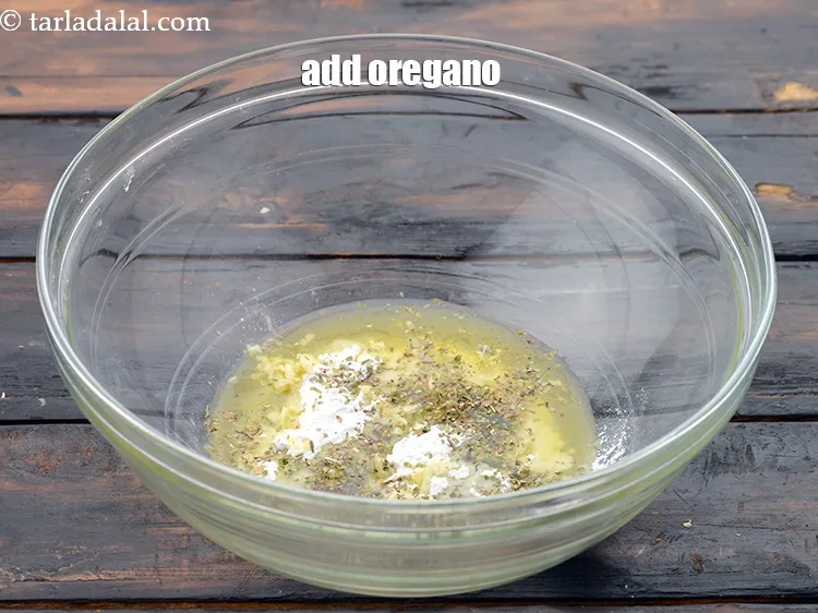 Step 7 – Add&nbsp;1/2 tsp&nbsp;<a href="https://www.tarladalal.com/glossary-dried-oregano-268i">dried oregano</a>.&nbsp;