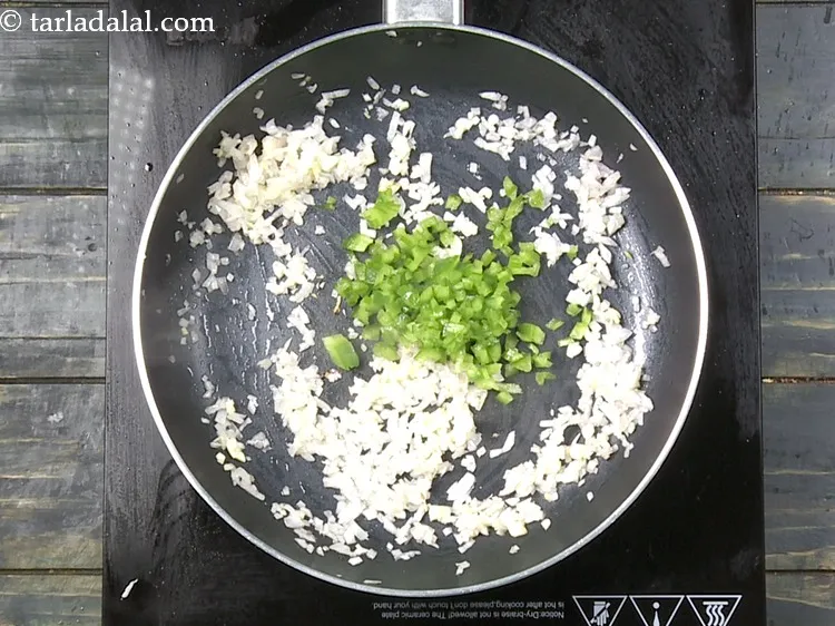 Step 14 – Add 1/4 cup&nbsp;finely&nbsp;<a href="https://www.tarladalal.com/glossary-chopped-capsicum-164i">chopped capsicum</a>.