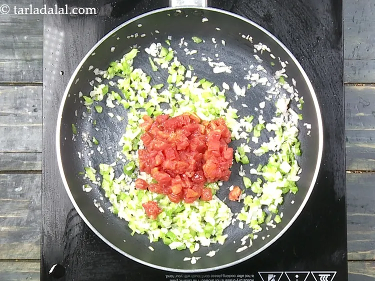Step 16 – Add 1/2 cup&nbsp;<a href="https://www.tarladalal.com/glossary-blanched-and-chopped-tomatoes-1883i">blanched and finely chopped tomatoes</a>.