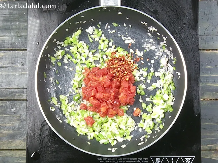 Step 17 – Add 1 tsp&nbsp;<a href="https://www.tarladalal.com/glossary-dry-red-chilli-flakes-paprika-338i">dry red chilli flakes (paprika)</a>.