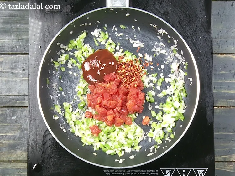 Step 18 – Add 2 tbsp&nbsp;<a href="https://www.tarladalal.com/glossary-tomato-ketchup-tomato-sauce-181i">tomato ketchup</a>.