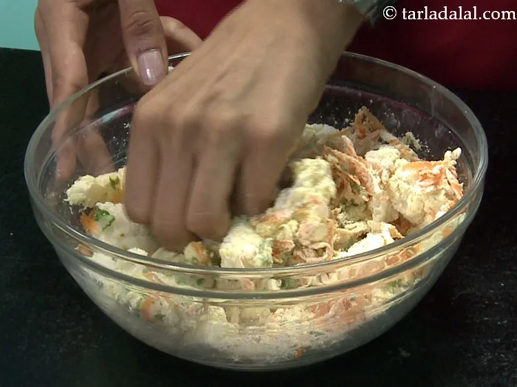 Step 14 – Mix well with your fingers. This is to ensure that the besan and spices coat …