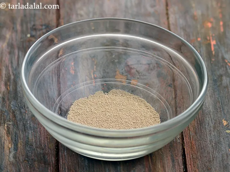 Step 3 – For the yeast mixture, add 2 tsp&nbsp;<a href="https://www.tarladalal.com/glossary-instant-dry-yeast-instant-sukha-khameer-2494i">instant dry yeast</a>&nbsp;in a bowl.