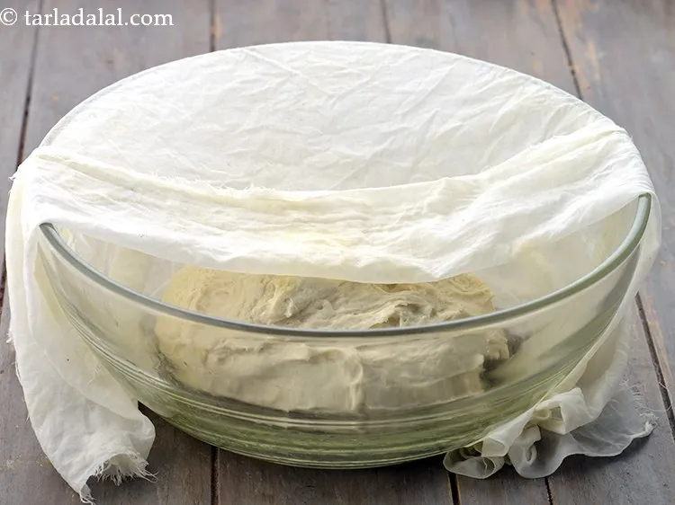 Step 14 – Transfer the dough into a greased deep bowl, cover it with a damp muslin cloth …