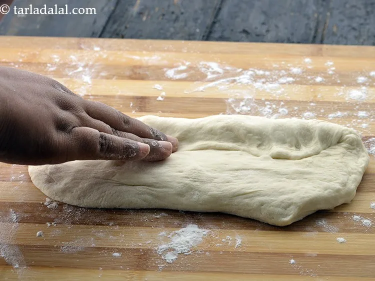 Step 19 – Do not knead it. Pull and fold again for 3 to 4 times.