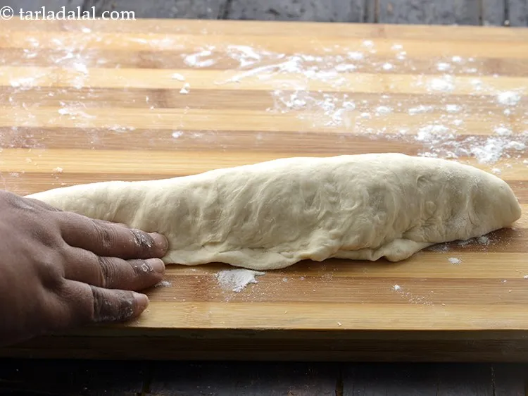 Step 21 – Take a portion of the dough, pat it to form a rectangle.