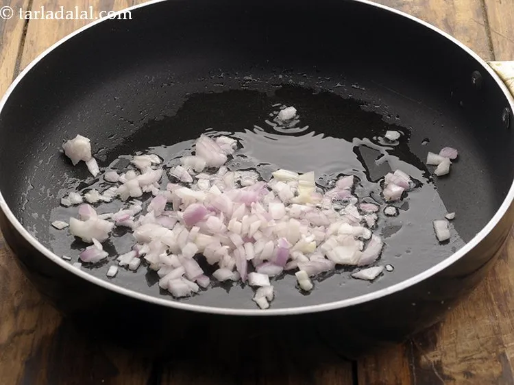 Step 15 – Once oil is hot, add onions.