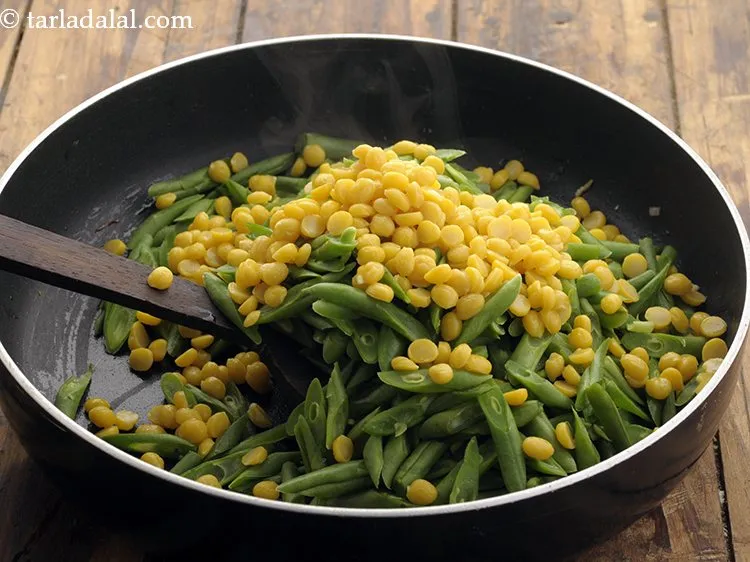 Step 22 – Add chana dal. You can even toss in some coconut if you like.