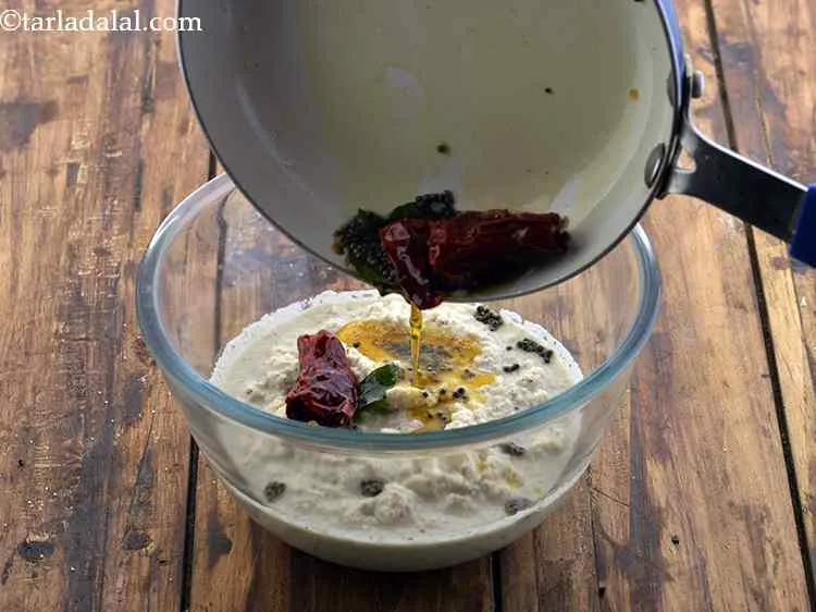 Step 13 – Pour this tempering over the prepared coconut chutney.