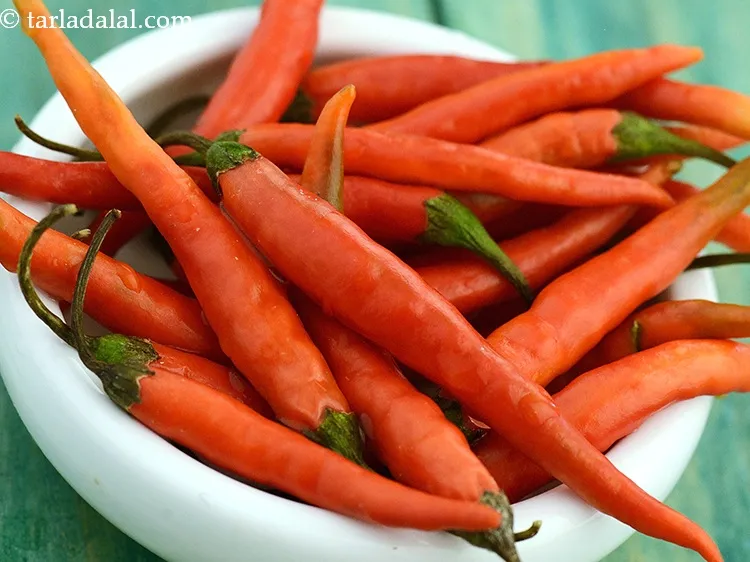 Step 23 – Green chillies for tempering can be replaced with red chillies.