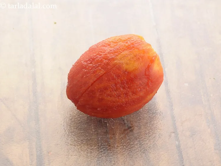 Step 8 – When the tomatoes are cool, peel and discard the skin and seeds.