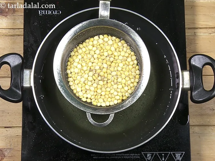 Step 28 – One indication that the dal is fried and ready is that the oil will stop …
