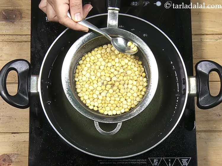 Step 29 – You can remove a little and check. You willrealise that the colour of the dal …