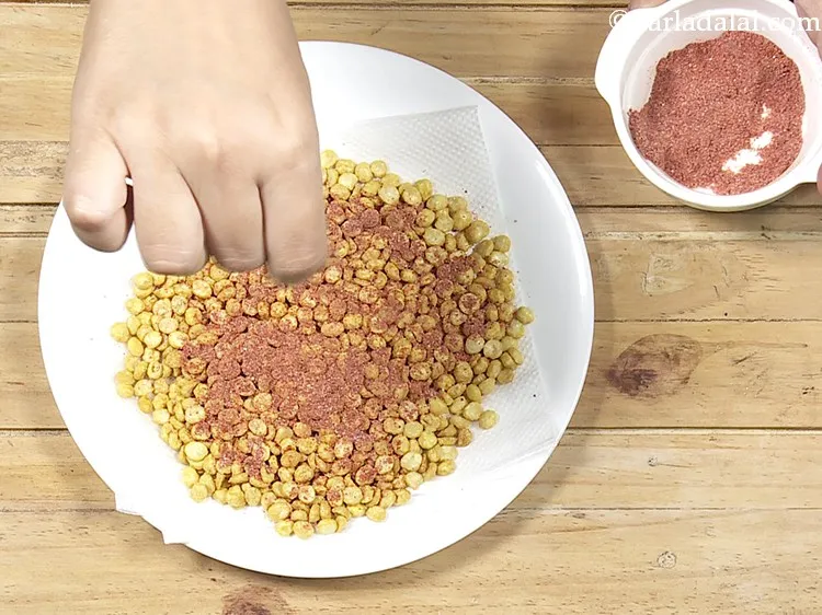 Step 34 – While the oil is yet hot, sprinkle half of the prepared spice mixture evenly over …