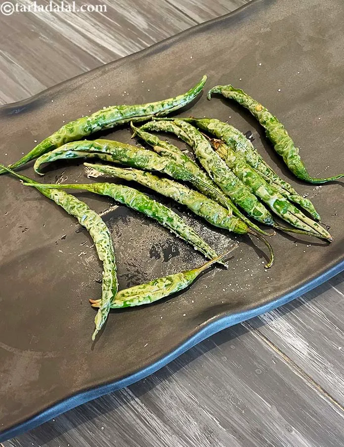 Step 8 – Serve. I love to have&nbsp;fried green chillies as a side dish with my meals. Deep-fried …