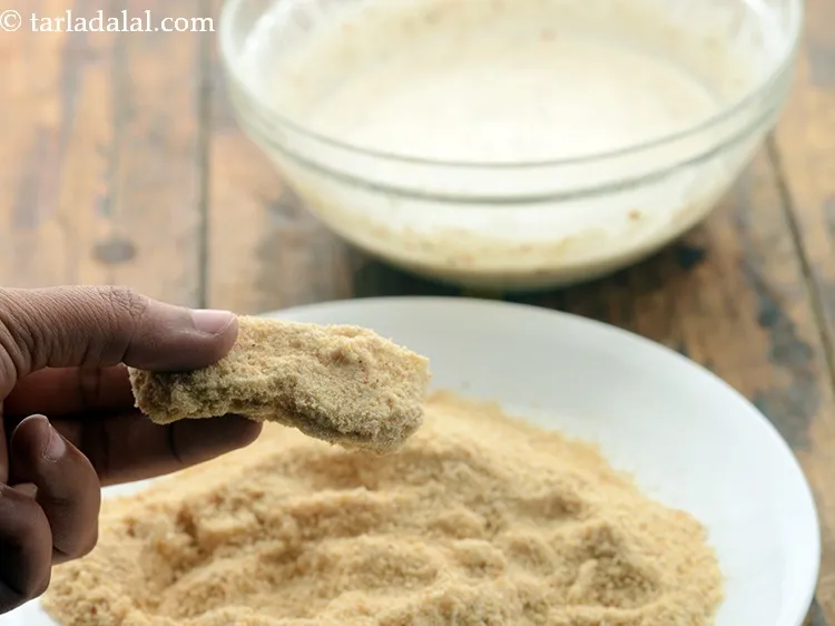 Step 10 – Roll the cheese sticks in bread crumbs till they are evenly coated from all the …