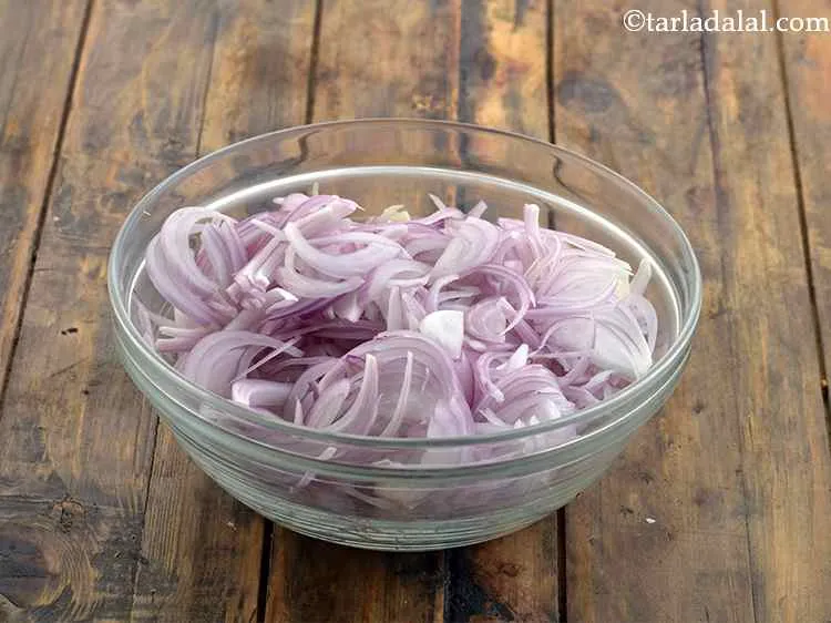 Step 30 – Also, thinly slice the onions and keep aside.