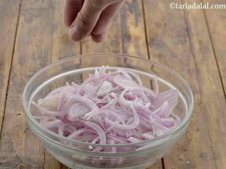 Step 2 – Sprinkle salt over the onions.