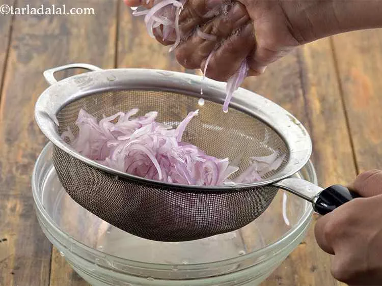 Step 26 – Squeeze out the excess water from the onions with your hands. If the onions have …