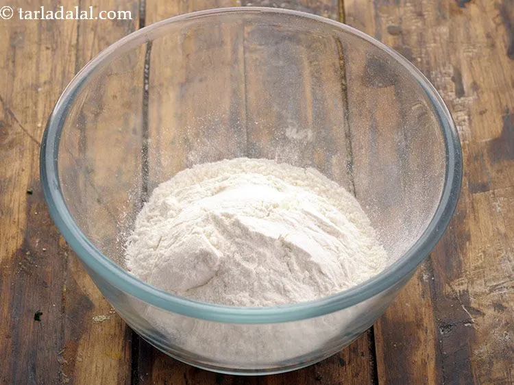 Step 3 – For the plain flour-water mixture, add 1/2 cup&nbsp;<a href="https://www.tarladalal.com/glossary-plain-flour-maida-188i">plain flour (maida)</a> in a deep bowl.