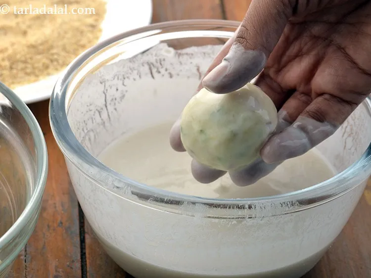 Step 21 – Dip each ball into the prepared plain flour-water mixture so that it is evenly coated …